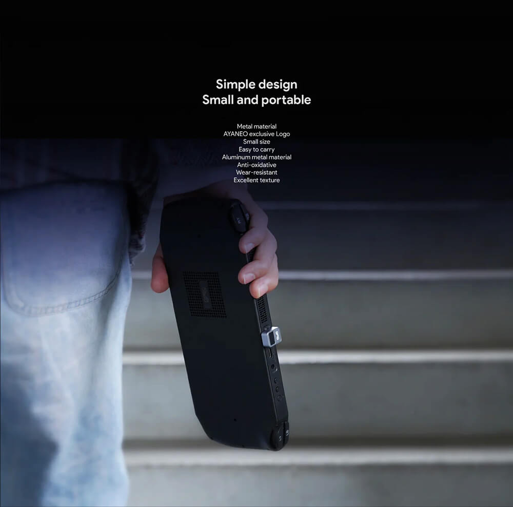 AYANEO Hola Fingerprint Scanner 2 AYANEO Hola Fingerprint Scanner plugged into AYANEO whilst held by a person.