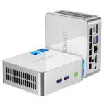 The image displays the GMKTEC M3 Mini PC, a compact and efficient computing device. It features a sleek, modern design with a matte black finish. The front panel includes multiple ports for connectivity, such as USB ports and an audio jack, and the GMKTEC logo is visible on the top surface. The design emphasizes portability and functionality, suitable for various computing needs.