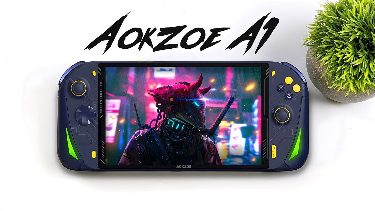 Image of the AOKZOE A1: A high-resolution handheld gaming console with a sleek, modern design. The device features a large touchscreen display at the center, flanked by two sets of control buttons and analog sticks on either side. The console has a streamlined, ergonomic shape, designed for comfortable handheld use. The display showcases a vibrant game scene, highlighting the console's graphical capabilities. The overall color scheme is a mix of black and dark gray, giving it a professional and stylish appearance.