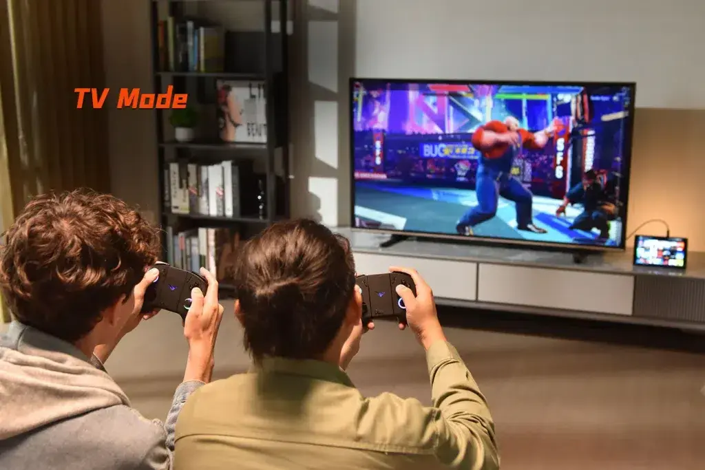 ONEXPLAYER X1 Mini in TV mode, connected to a large screen with two players gaming together using detached controllers, highlighting its versatility for multiplayer gaming on a bigger display.