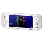 A White AYN Odin 2 Portal handheld gaming console displaying an action-packed RPG game. The screen shows a character using a fiery attack against enemies in a frozen landscape. The device has an ergonomic design with illuminated thumbsticks.