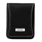 AYANEO-POCKET-DMG-CASE-LISTING-DONE-01 A black, rectangular protective case with a mesh-like texture covers the entire surface. A white label with "AYANEO" in black text is centered near the bottom of the case. The case appears to be closed and is presented against a plain, light gray background.