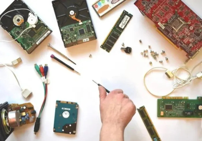 A range of computer hardware laid out across a table, showing a huge range