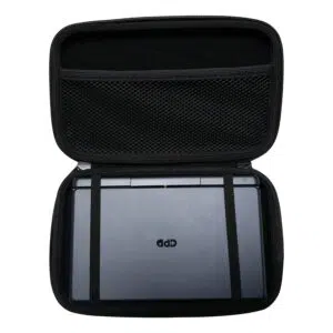 A top-down shot of the open, black hard shell case for the GPD MicroPC 2. A grey GPD MicroPC 2 is secured inside the bottom half with two black elastic straps. The top half of the case has a mesh pocket. The front of the MicroPC 2 is facing upwards, showing the "GPD" logo.