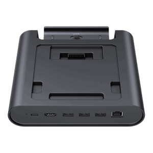 A three-quarter frontal view of a black GPD WIN 5 docking station, isolated against a black background. The dock features an array of ports on the front edge, including USB-C, USB-A, and an RJ45 Ethernet port. The recessed top area is designed to hold the GPD WIN 5 and includes a connector for charging and data.