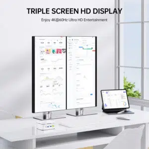 Triple display workstation setup showing a silver GMKtec G10 Mini PC driving two vertical monitors and an adjacent tablet display simultaneously at 4K resolution at 60Hz.