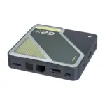 Angled RockTek G2 Next Google TV box in dark gray with translucent top, visible HDMI, LAN, S/PDIF and microSD ports