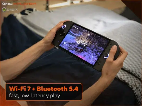 Black OneXPlayer 3 handheld gaming PC held in hands for wireless play over Wi-Fi 7, Bluetooth 5.4