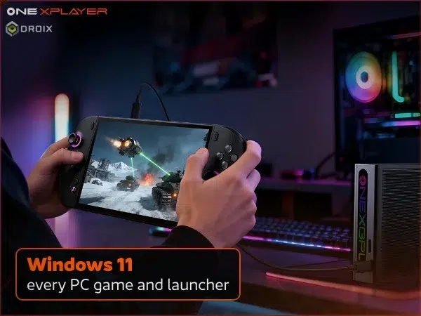 ONEXPLAYER 3 running a Windows game, held beside a desktop PC